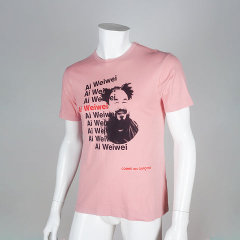 Comme des Garçons pink 2010 tee featuring portrait of Chinese artist, Ai Weiwei.
