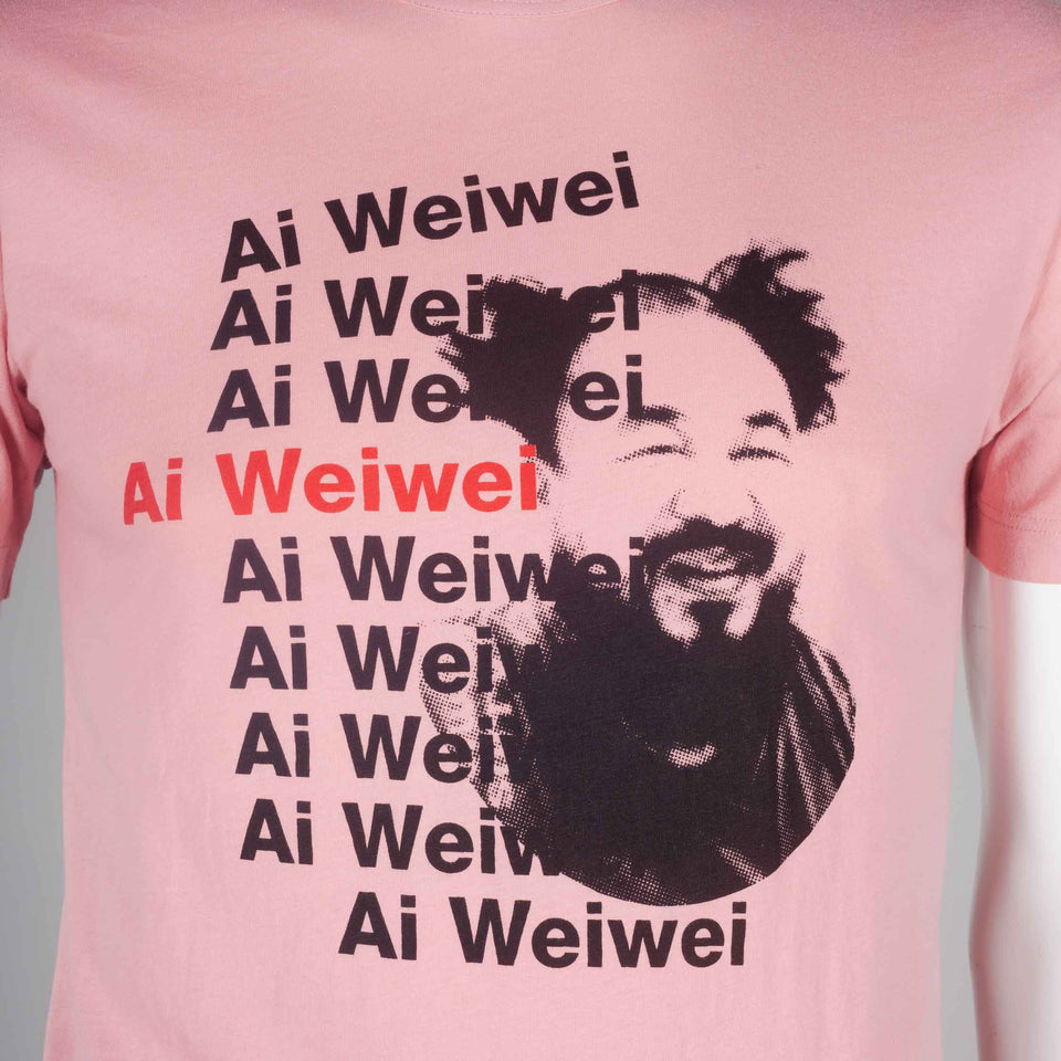 Comme des Garçons pink 2010 tee featuring portrait of Chinese artist, Ai Weiwei.