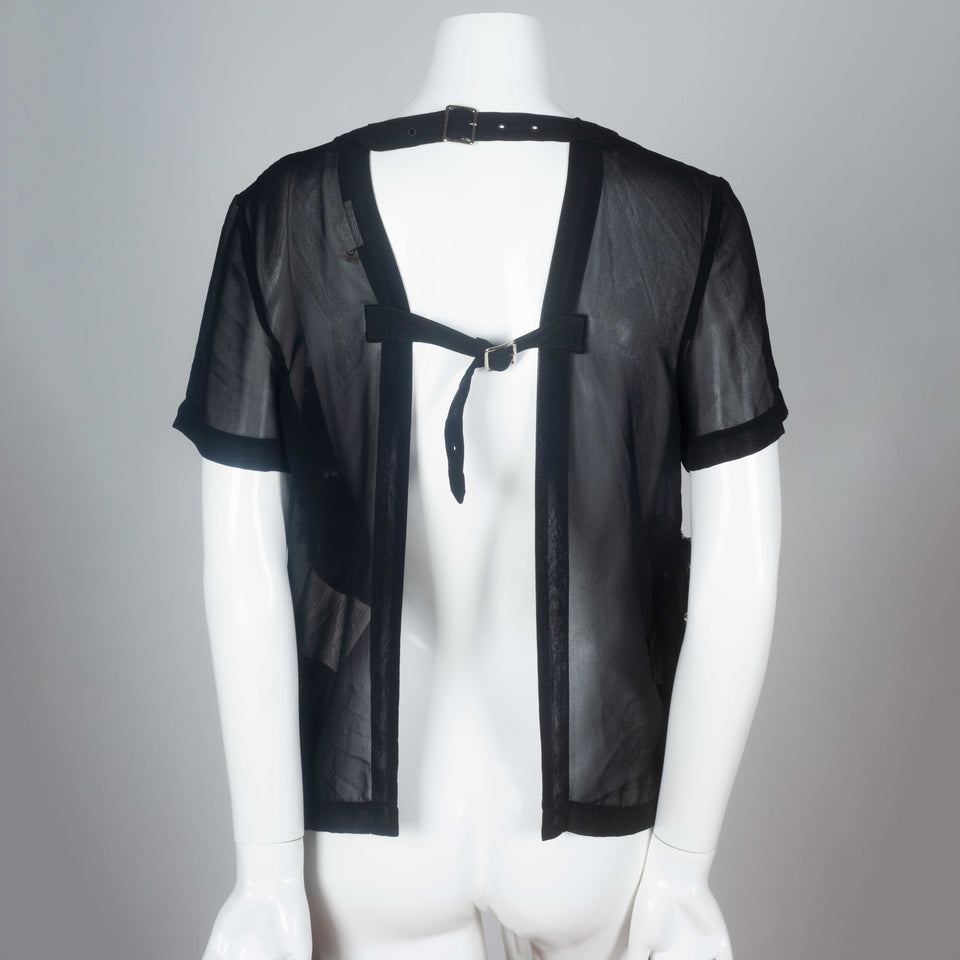 Comme des Garçons 2014 black chiffon short sleeve blouse with ruffled front and open back.