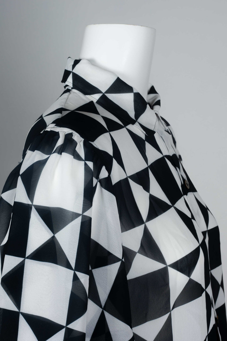 Comme des Garçons 1989 chiffon blouse from Japan with black and white geometric motif, short lantern sleeves and cut away collar.