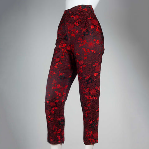 Comme des Garçons 1991 black trousers with bright red all-over flower and leaf embroidery.