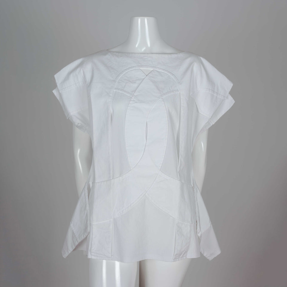 Comme des Garçons 2014 white shirt called "Flat Pack" with overlapping layers of white cotton and an intriguing silhouette.