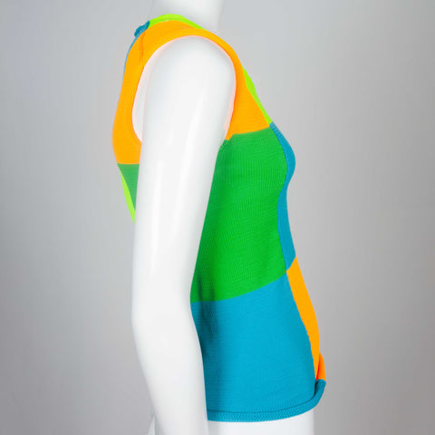 A 1995 neon color block knit sleeveless top from Japan by Comme des Garçons.