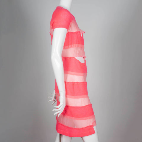 Comme des Garçons Tricot 2013, a neon pink sweater dress with alternating sheer horizontal strips. 