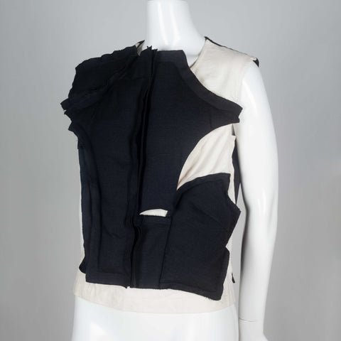 Comme des Garçons 2010 sleeveless shirt with asymmetrically padded front.