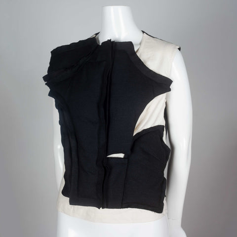 Comme des Garçons 2010 sleeveless shirt with asymmetrically padded front.
