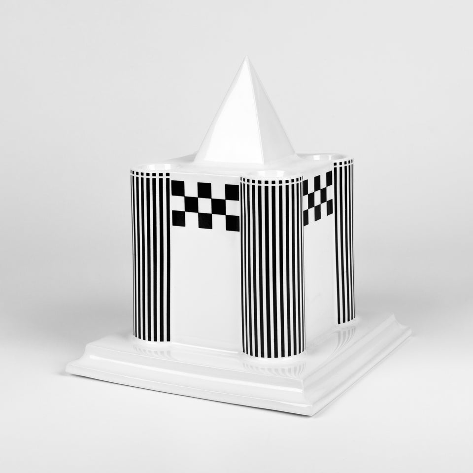 Candle holder in the shape of a Viennese castle in glazed porcelain with black and white painted graphics. 