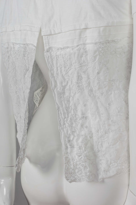 Comme des Garçons Tao, a white cotton t-shirt with embroidered linen lower that looks like lace.