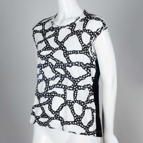 Comme des Garçons 2010 black and white sleeveless t-shirt with sinuous graphic design.