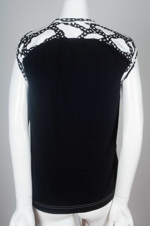 Black back of this Comme des Garçons 2010 black and white sleeveless t-shirt with sinuous graphic design.