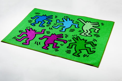 Keith Haring green rug with colorful dancing figures. 