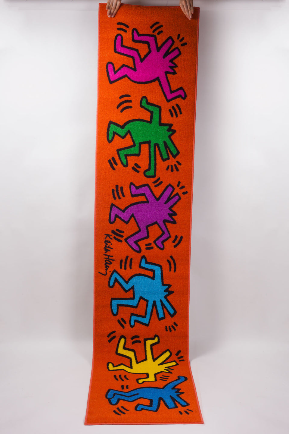 Brilliant colors in this Keith Haring runner with dancing figures, distributed by Comart Italia. 