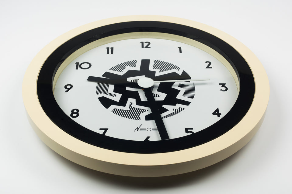 Postmodern wall clock designed by the Memphis Group founding members and couple, George Sowden and Nathalie du Pasquier. 